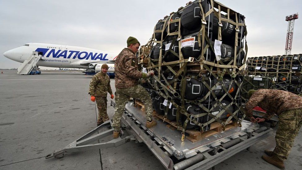 Image shows anti-tank missiles being unloaded
