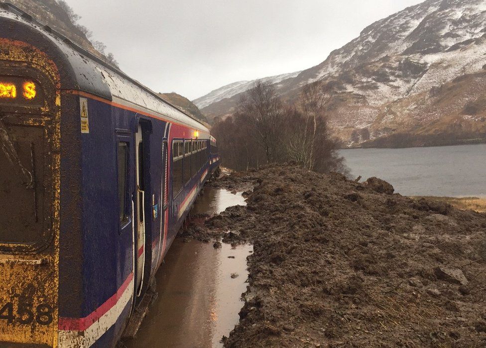 Train trapped in landslide