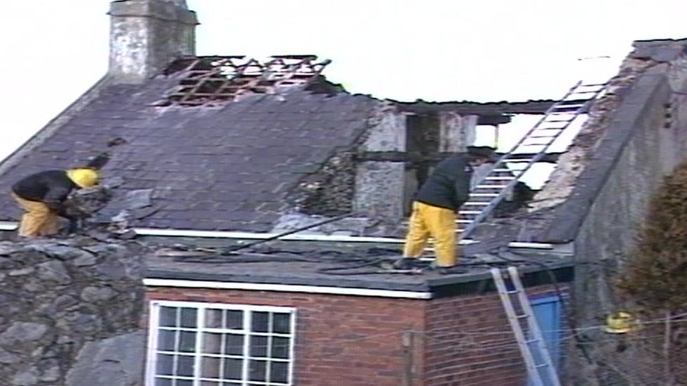 Firemen tackling a blaze at a holiday home