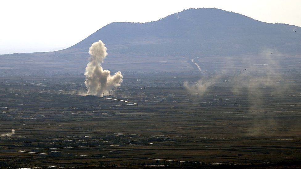 Smoke rising from clashes in Syria, as seen from the Israeli-occupied Golan Heights