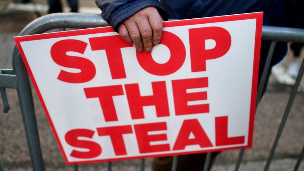 A sign reads "Stop the Steal"