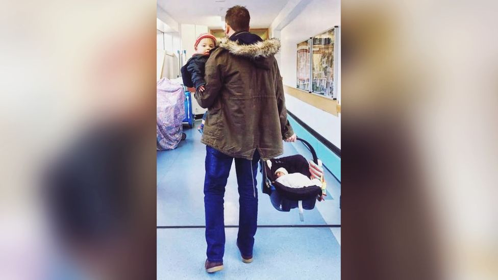 Going home: Elis leaves hospital with Aron and Seth