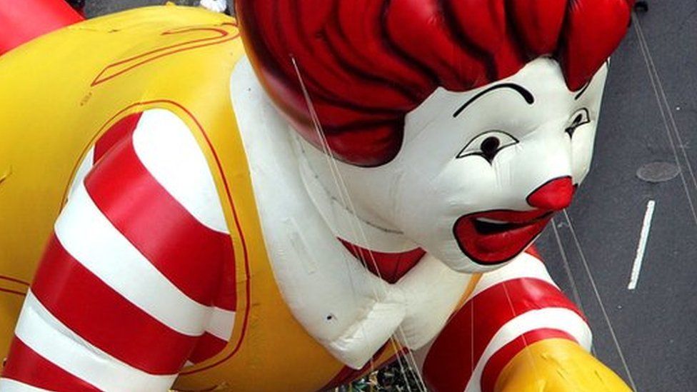 The Ronald McDonald balloon floats down Broadway