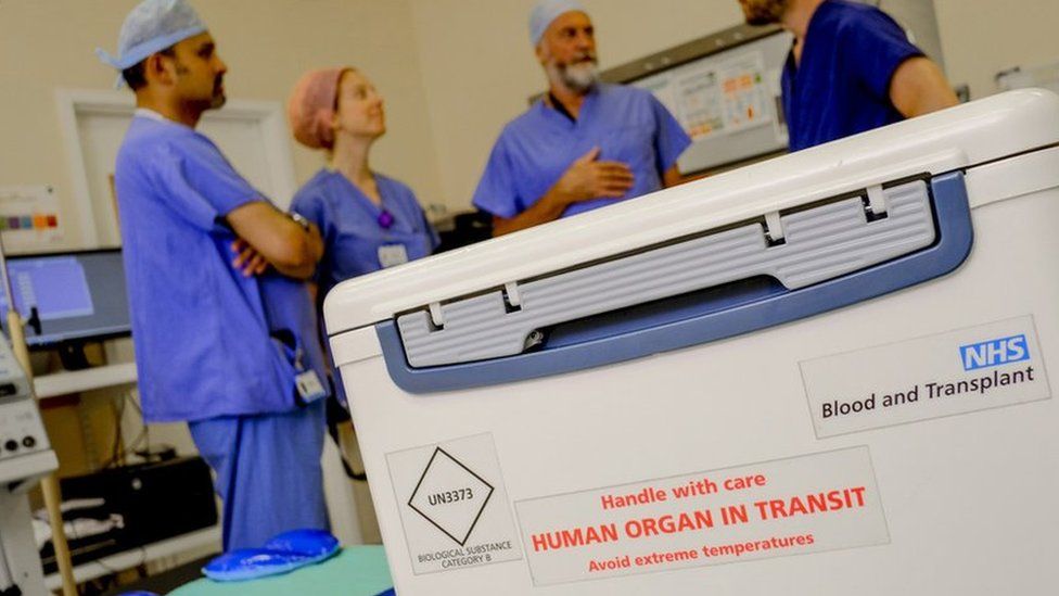 Box with organ for transplant reading "handle with care: human organ in transit"
