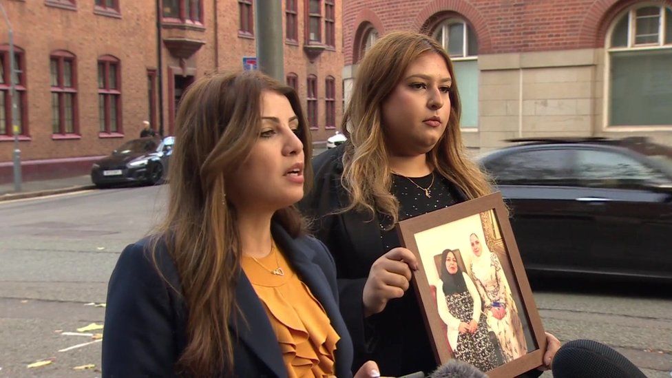 Naur Norris, left, speaking outside court as Kinaan Slaeem holds a photo of Raneem Oudeh and her mother Khaola Saleem
