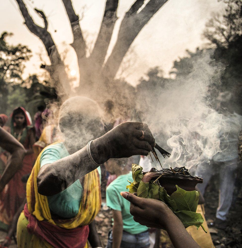 Incense rises up from leaves