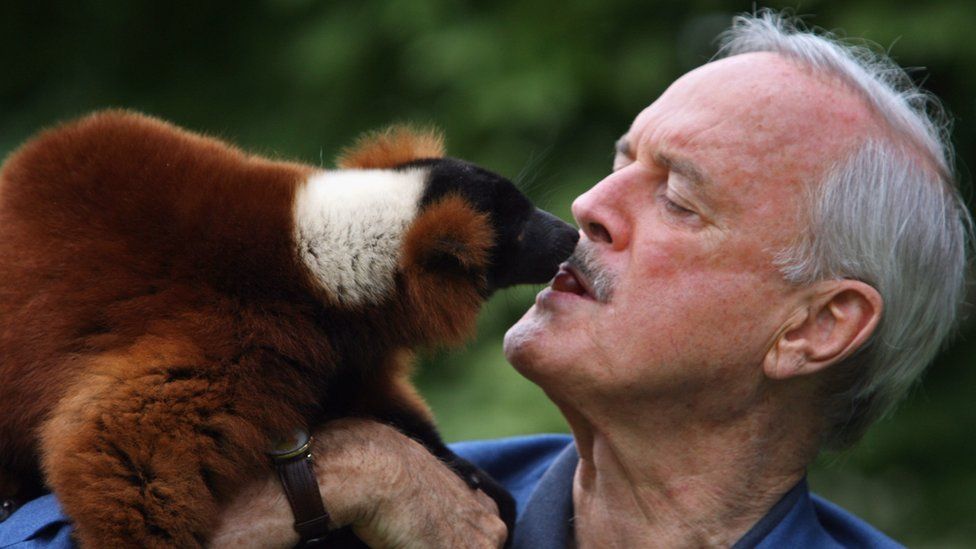 John Cleese with a lemur