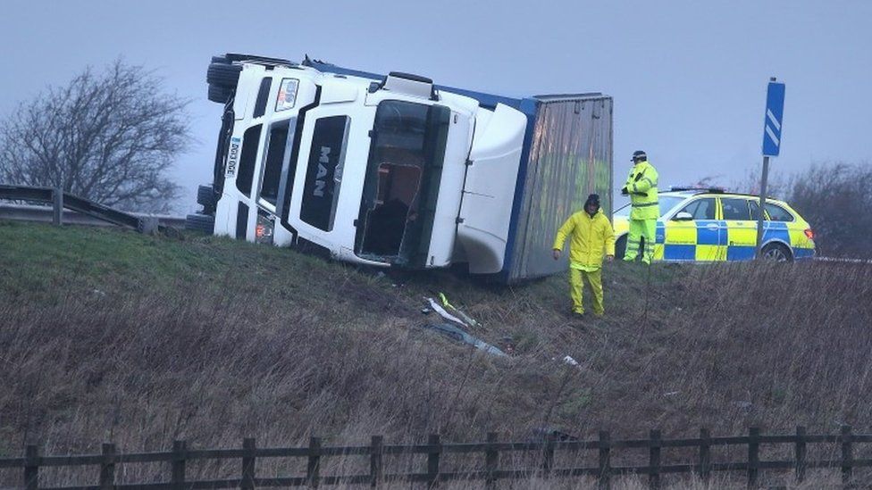 Overturned lorry on the M9