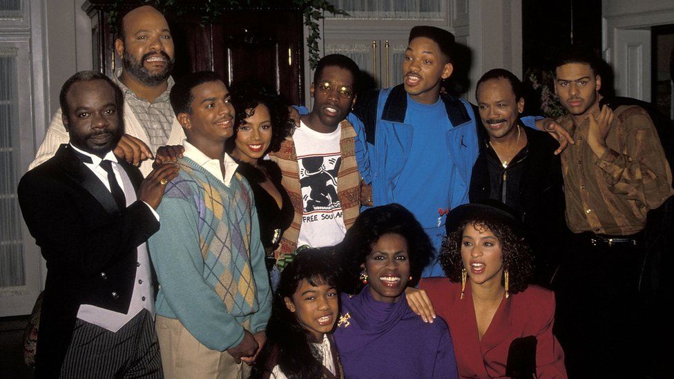 Joseph Marcell, James Avery, Alfonso Ribeiro, singer Tyler Collins, Kadeem Hardison, Will Smith, producer Quincy Jones, singer Al B. Sure!, Tatyana Ali, Janet Hubert and Karyn Parsons break from filming "The Fresh Prince of Bel-Air" in 1990