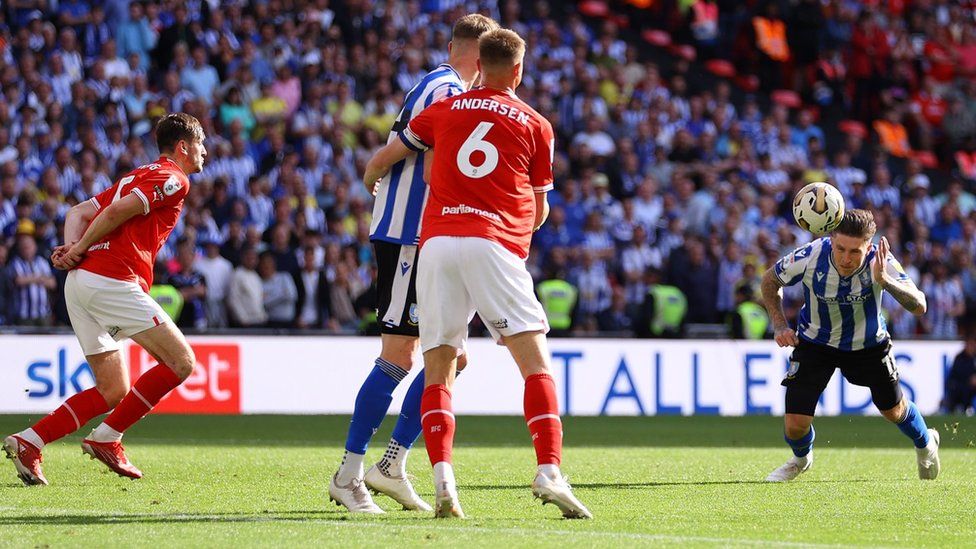Josh Windass scores a header for Sheffield Wednesday during the League One play-off final