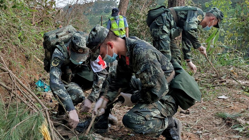 China plane crash: Rescuers search for survivors as families await news -  BBC News