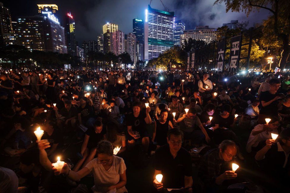 Attendees gather at Victoria Park during a candlelight vigil to commemorate the 30th anniversary of the Tiananmen Square crackdown in Hong Kong, China, on Tuesday, June 4, 2019.