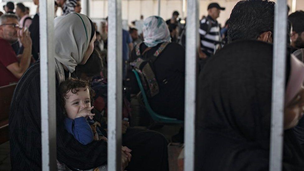 People waiting at the Rafah crossing