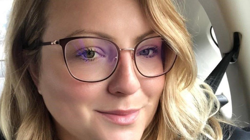 Melissa Burr, a young woman with blonde hair wearing glasses