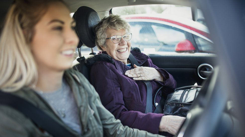 Older woman with younger woman in car