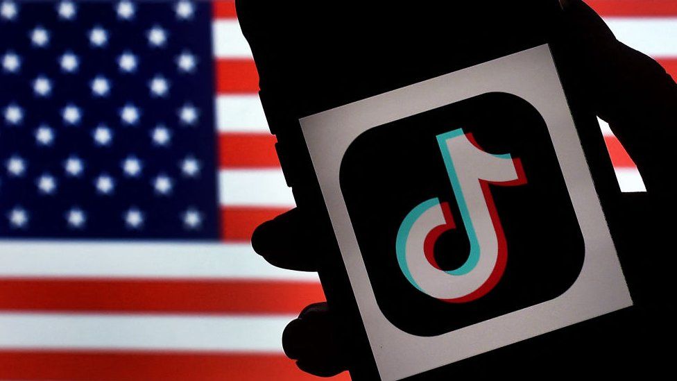 An image of the tiktok logo and the American flag