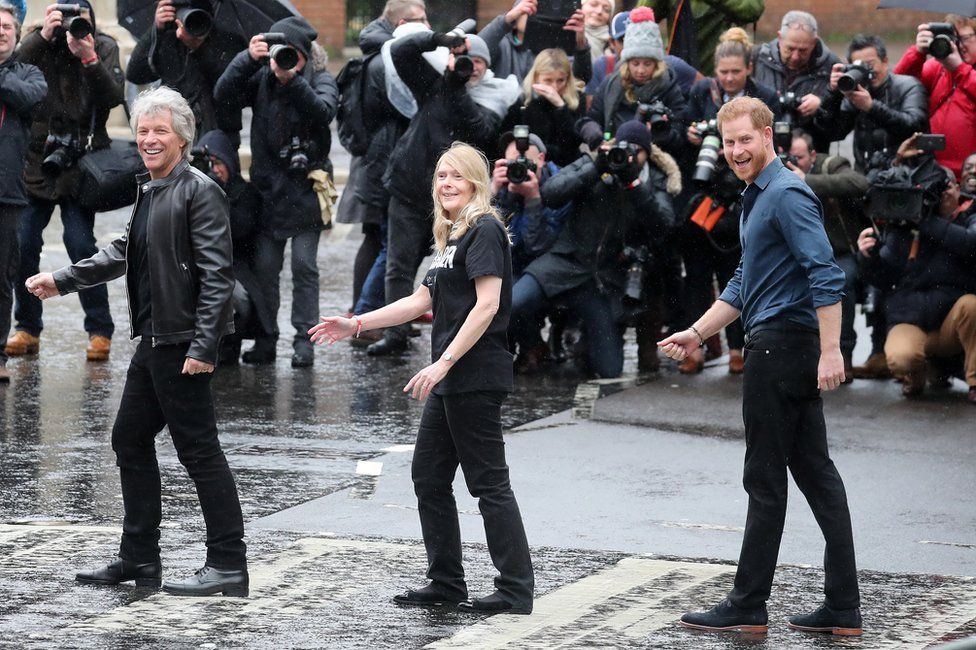 The Duke of Sussex, singer Jon Bon Jovi and Invictus Games representatives are seen on the iconic Abbey road crossing