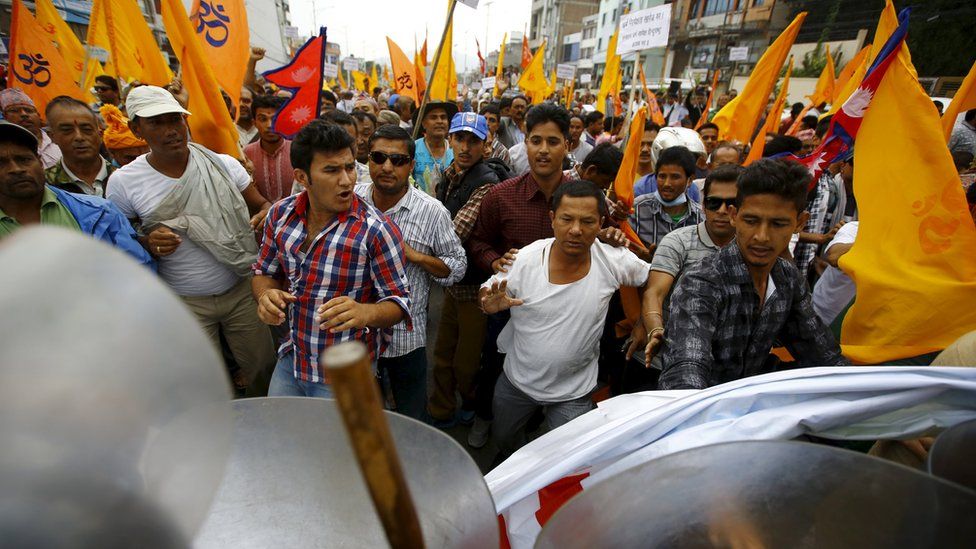 Hindu activists march forward while trying to break through a restricted area near the parliament during a protest rally demanding Nepal to be declared as a Hindu state in the new constitution, in Kathmandu, Nepal September 14, 2015.