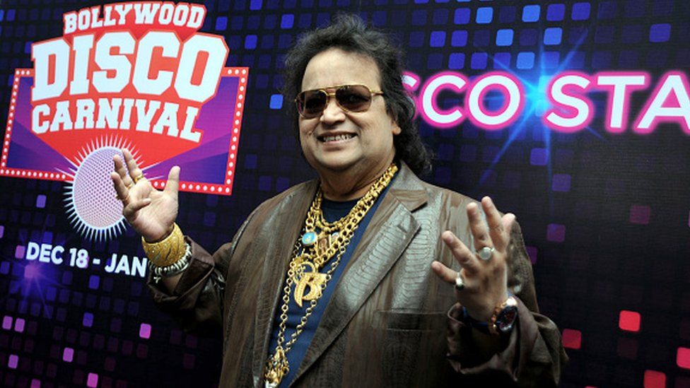 Indian Bollywood music composer and singer Bappi Lahiri poses during the Christmas and New Year's Bollywood Disco Carnival in Mumbai on December 18, 2015.