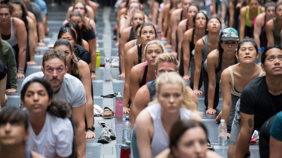 Hundreds of people attend a yoga class in Sydney