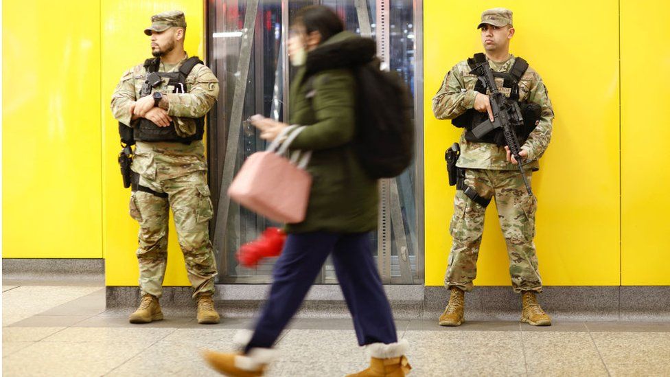 National Guard members stand watch at New York City's Penn Station.