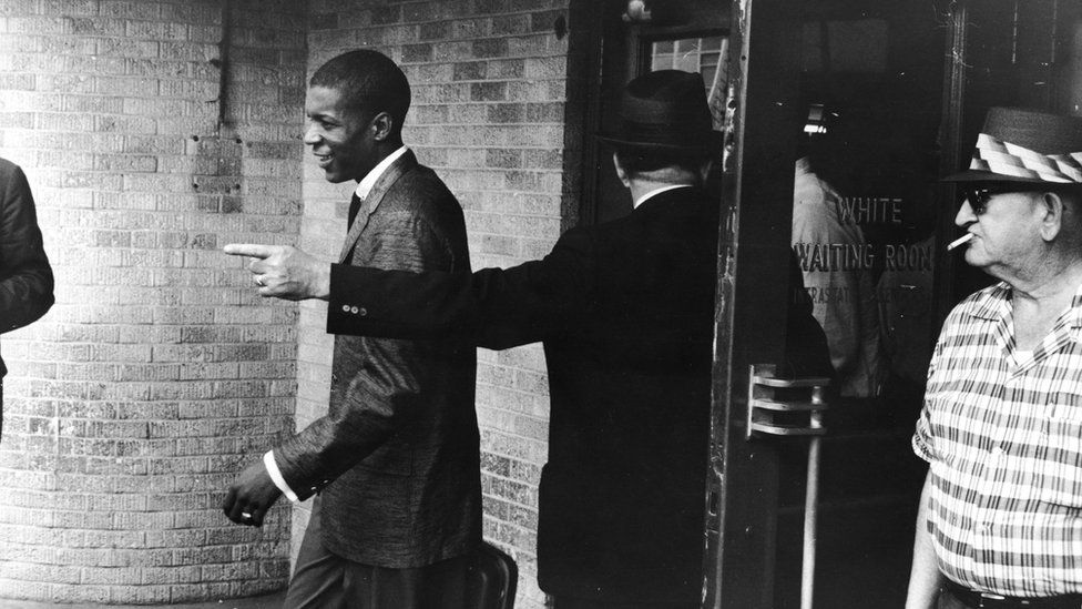 A young Black "Freedom Rider" is told to leave a segregated "white" waiting room at a bus depot in Jackson, Mississippi, May 26, 1961