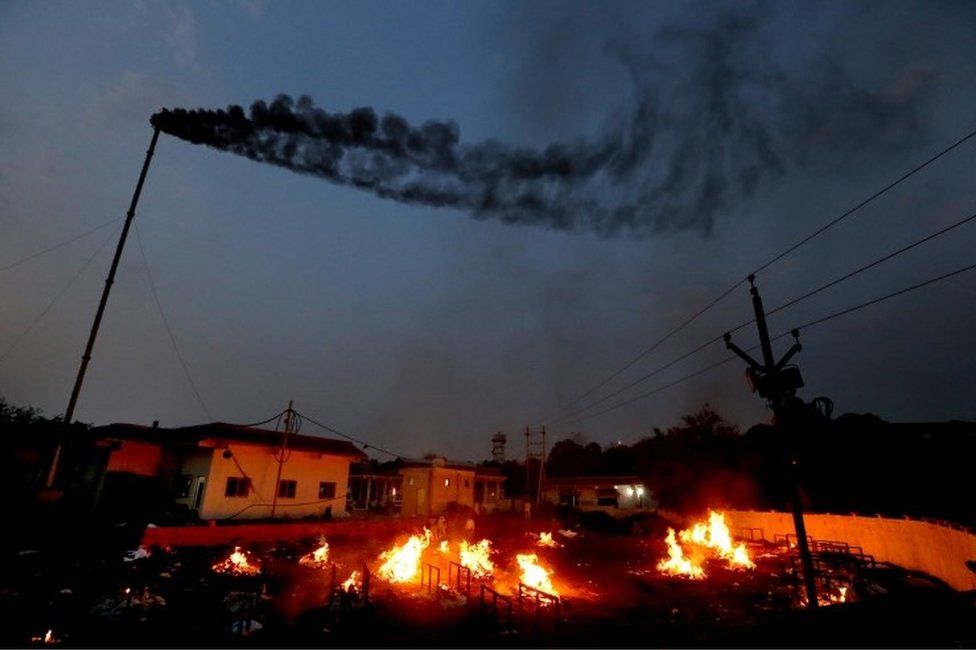 A general view showing burning funeral pyres as relatives perform last rites for covid-19 victims in Bhopal, India, 15 April 2021
