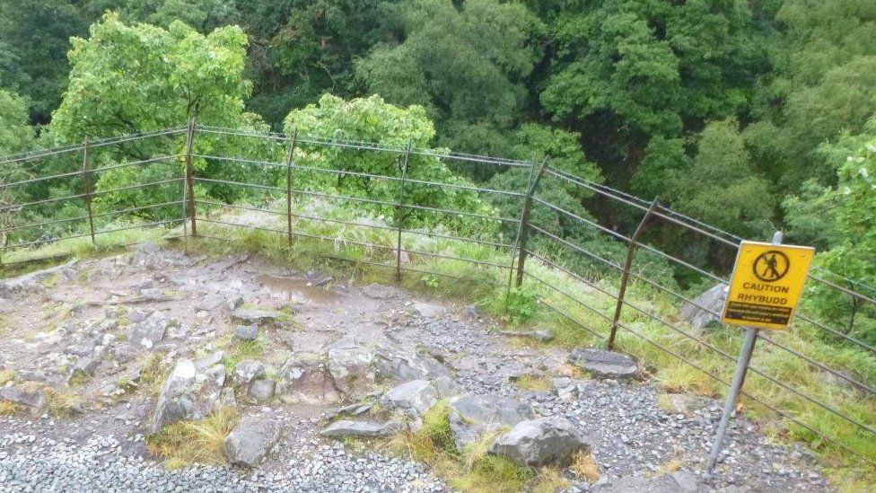 Warning signs are in place near the waterfall