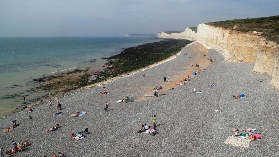 People on the beach at Birling Gap