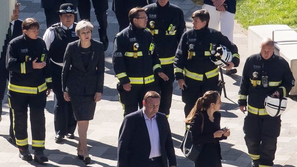 Prime Minister Theresa May with firefighters