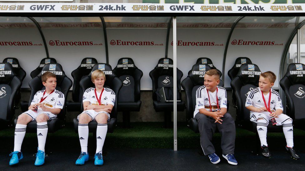 Swansea City mascots in dug-out