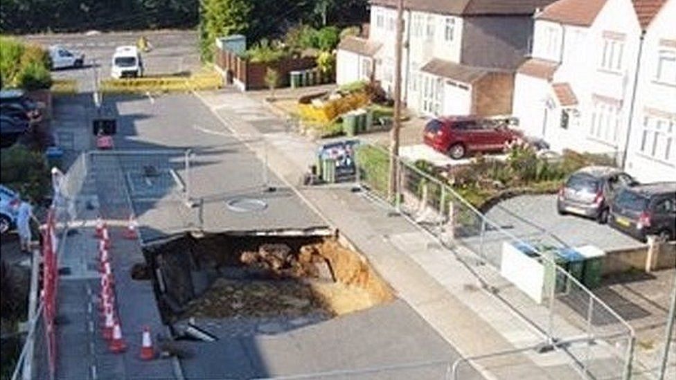 The Bexleyheath sinkhole with police looking on and cordons in place