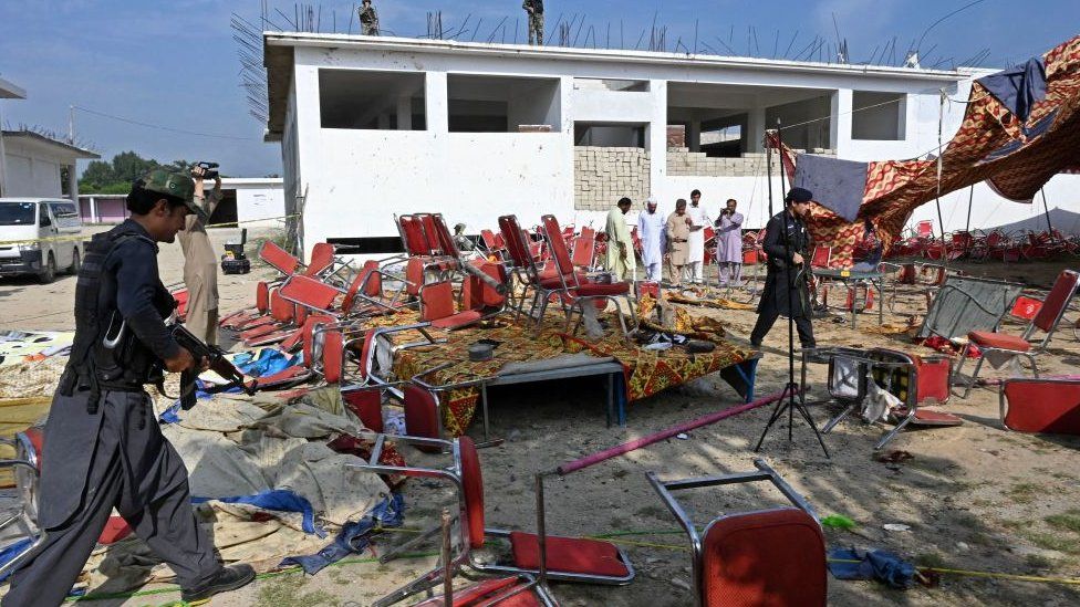 Security personnel examine the site of a bomb blast in Bajaur district of Khyber-Pakhtunkhwa province on July 31, 2023.