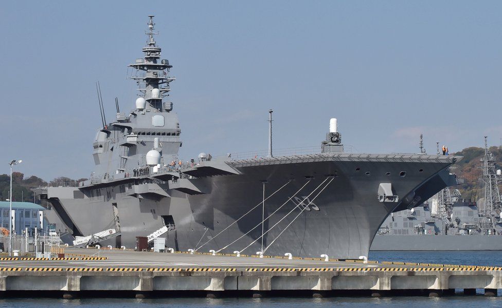 This picture taken on 6 December 2016 shows the helicopter carrier Izumo at a berth in its Yokosuka Base in Kanagawa prefecture