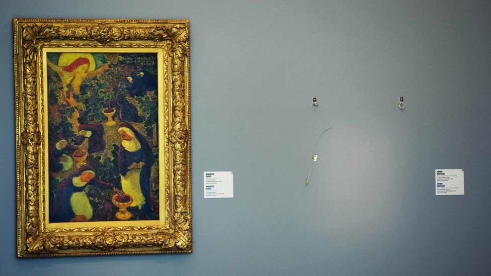 In this file photo taken on October 16, 2012, an empty space is seen where a painting by French artist Henri Matisse was stolen at the Kunsthal museum in Rotterdam, a day after seven masterpieces were stolen in a pre-dawn heist.