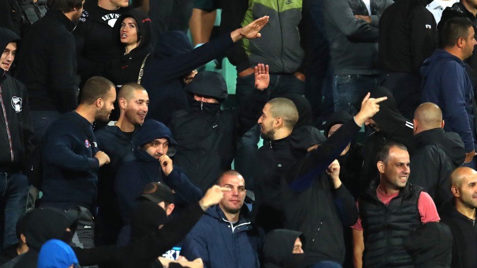 Bulgarian fans give Nazi salutes during the match against England