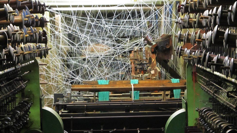 Belper mill exhibition: Tiny figures hidden in giant web - BBC News