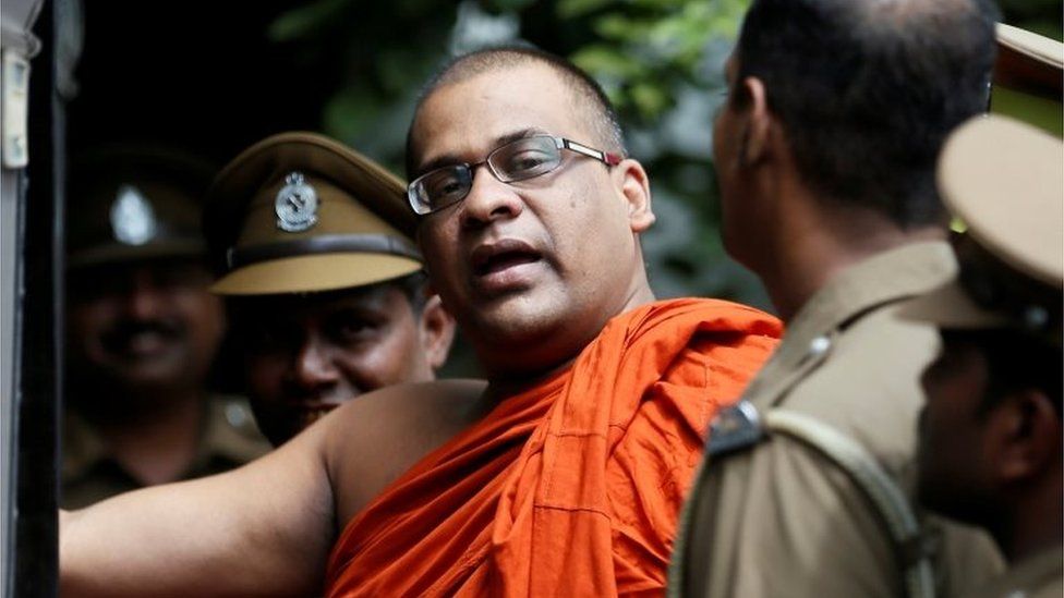 Galaboda Aththe Gnanasara Thero walks towards a prison bus in Homagama, Sri Lanka, 14 June 2018