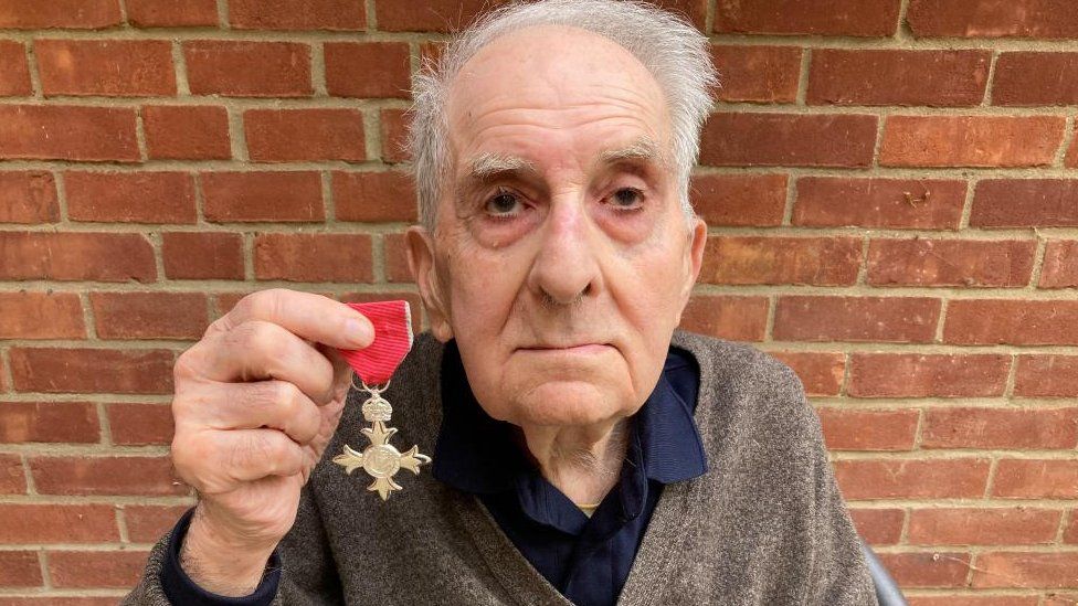 Frank Bright with his MBE medal