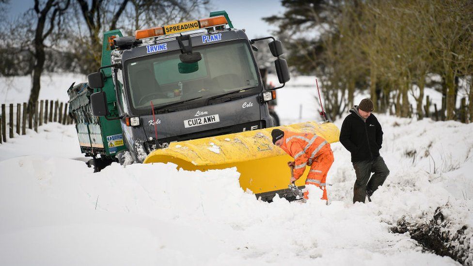 Snow plough stuck in drift in the Scottish Borders