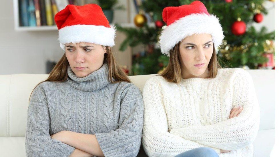 Two young women looking cross