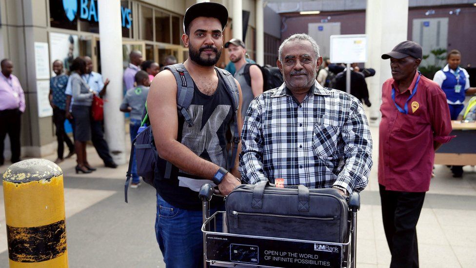 Passenger Ahmed Khalid who missed his Ethiopian Airlines Flight pictured with his father
