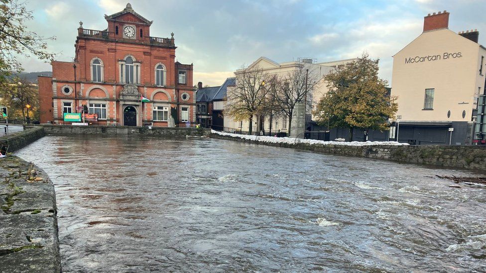 Newry Town hall with high waters at the bridge