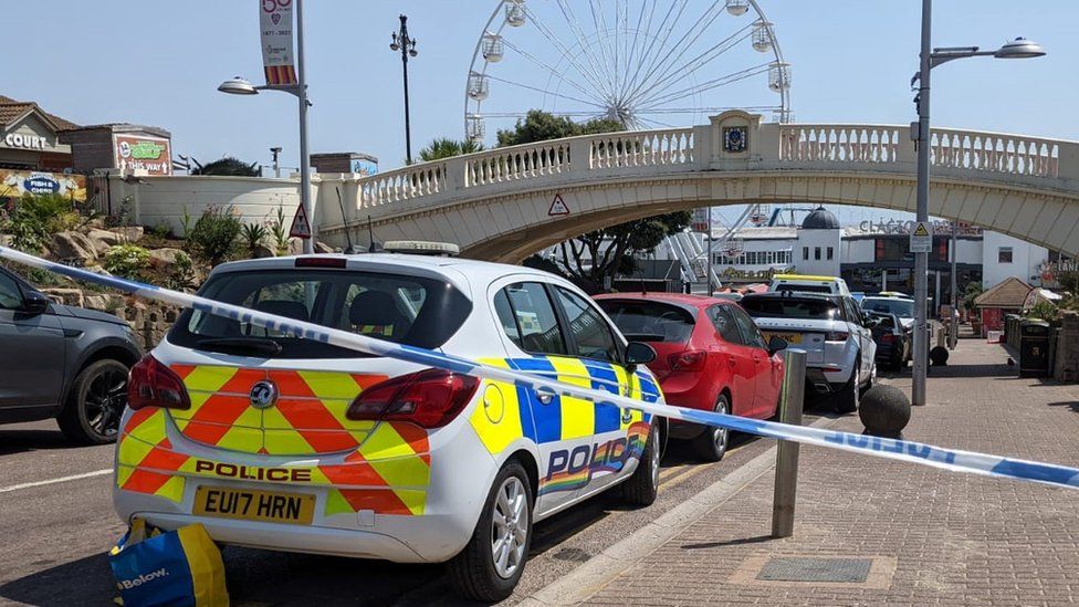 Police car and police tape at Clacton Pier