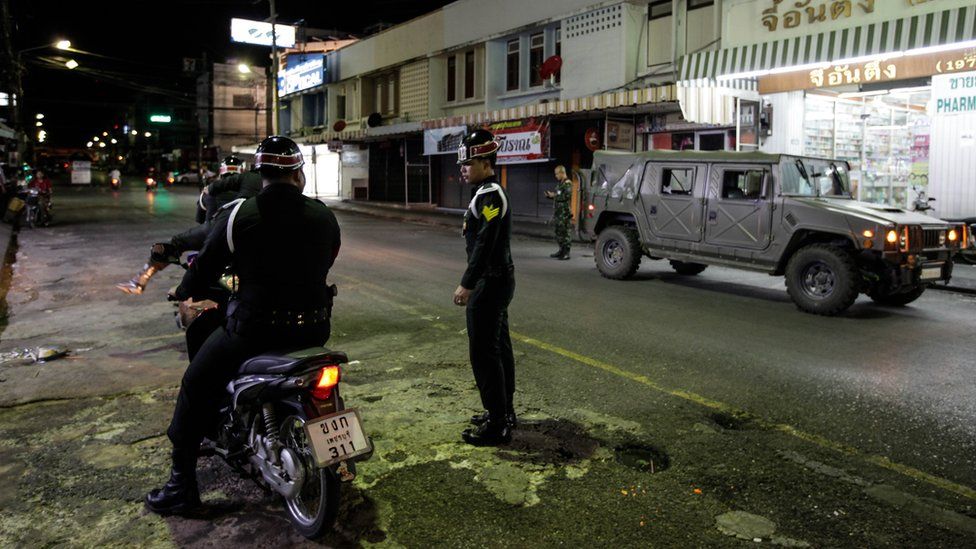 Thai army officers patrol the streets in Hua Hin, Thailand (12 August)