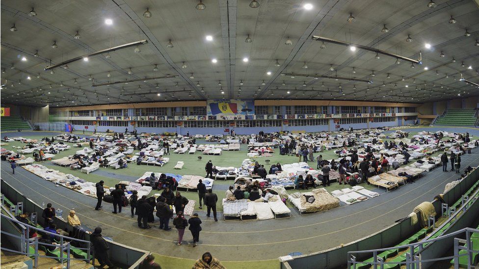 People fleeing the Ukraine conflict at an athletics arena in Chisinau, Moldova
