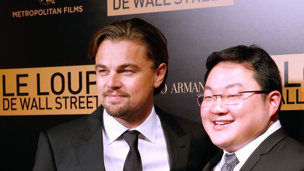 Actor Leonardo DiCaprio with Jho Low (right) of the movie attend the photocall before the 'The Wolf of Wall Street' World movie Premiere at Cinema Gaumont Opera on December 9, 2013 in Paris, France.