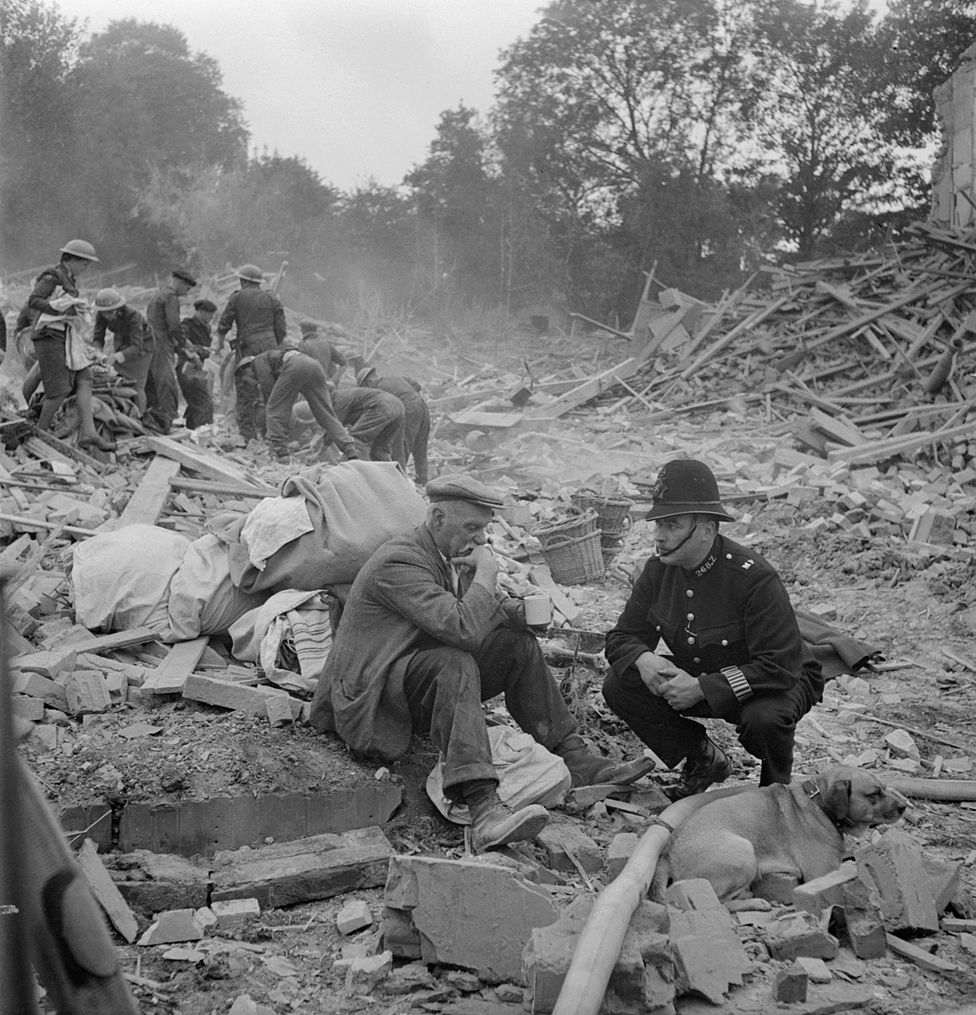 Man comforted after V1 rocket attack, 1944