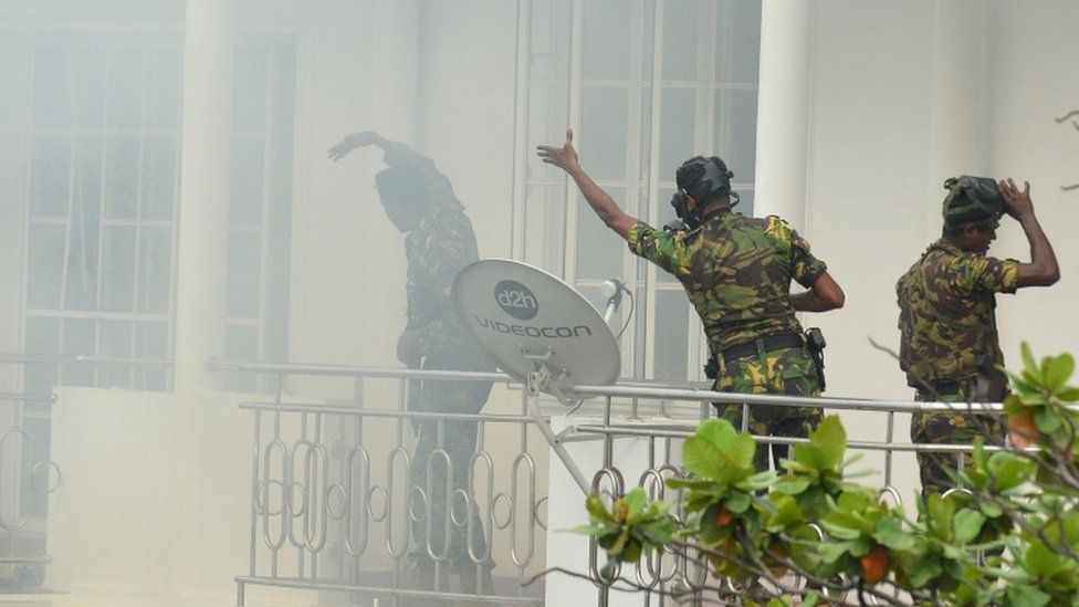 A bomb goes off as Special Task Force personnel raid a home near Dematagoda in Colombo