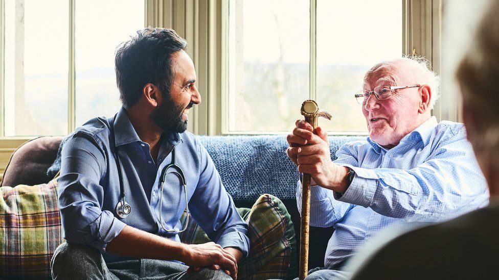 A man visiting his relative in a care home